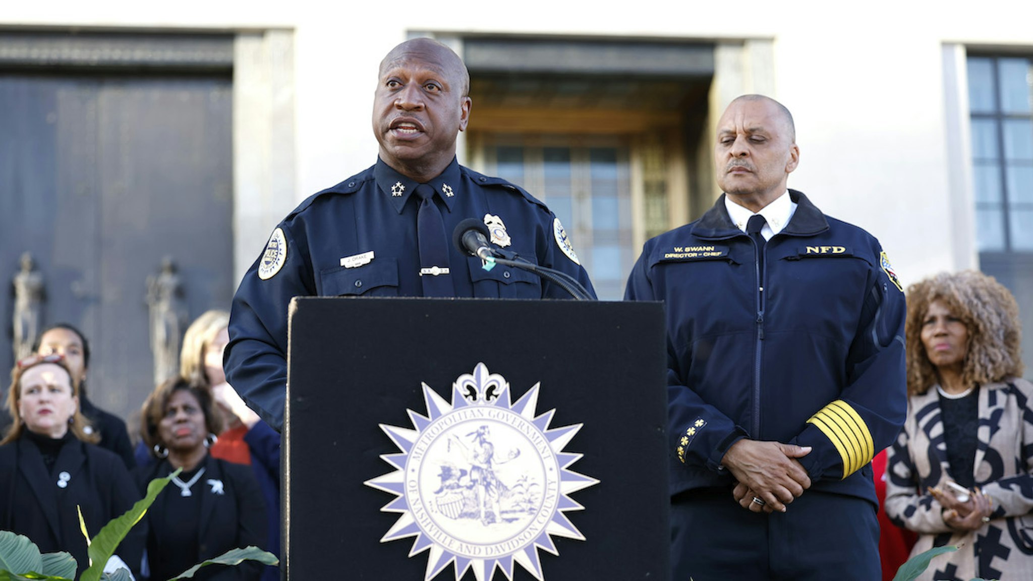 Nashville Chief of Police John Drake and Nashville Fire Department Chief William Swann attend a candlelight vigil to mourn and honor the lives of the victims, survivors and families of The Covenant School on March 29, 2023 in Nashville, Tennessee. (Photo by Jason Kempin/Getty Images)