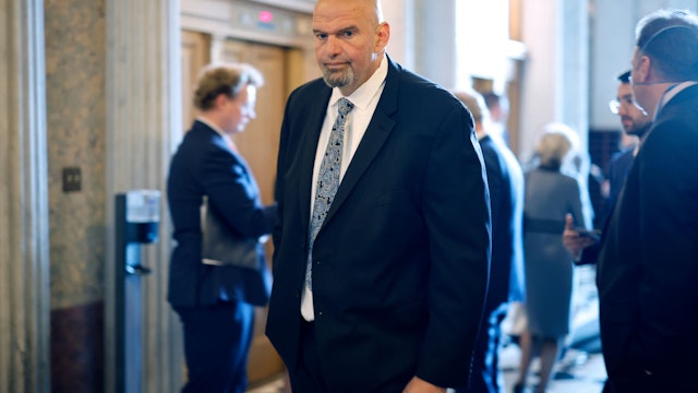 WASHINGTON, DC - MAY 10: Sen. John Fetterman (D-PA) heads to the Senate Chamber for a vote at the U.S. Capitol on May 10, 2023 in Washington, DC. Republican and Democratic Congressional leaders met with President Joe Biden at the White House yesterday to continue to negotiate how to raise the debt limit. (Photo by Chip Somodevilla/Getty Images)