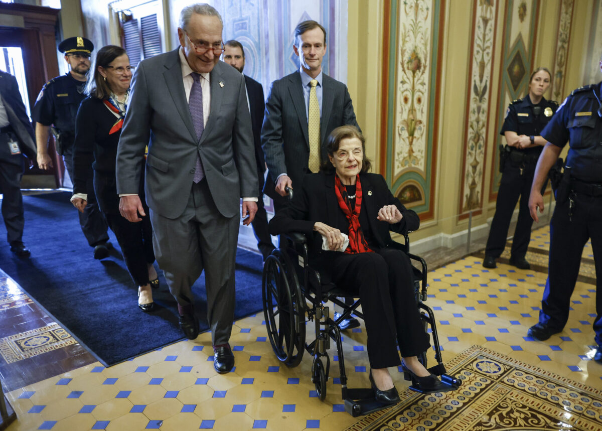 Feinstein back in Senate on wheelchair, requires lighter workload.