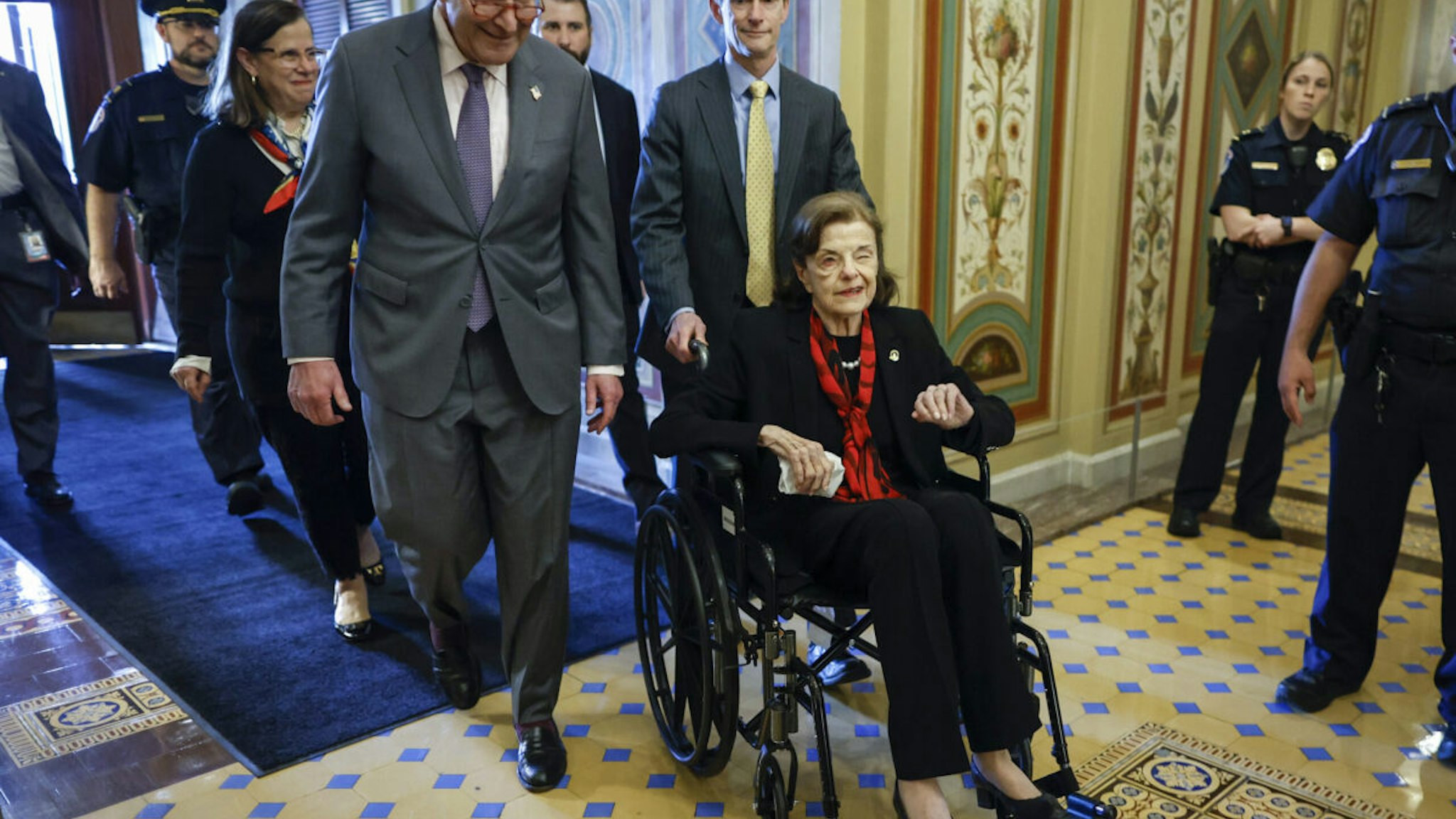 U.S. Senate Majority Leader Charles Schumer (D-NY) escorts Sen. Dianne Feinstein (D-CA) as she arrives at the U.S. Capitol following a long absence due to health issues on May 10, 2023 in Washington, DC.