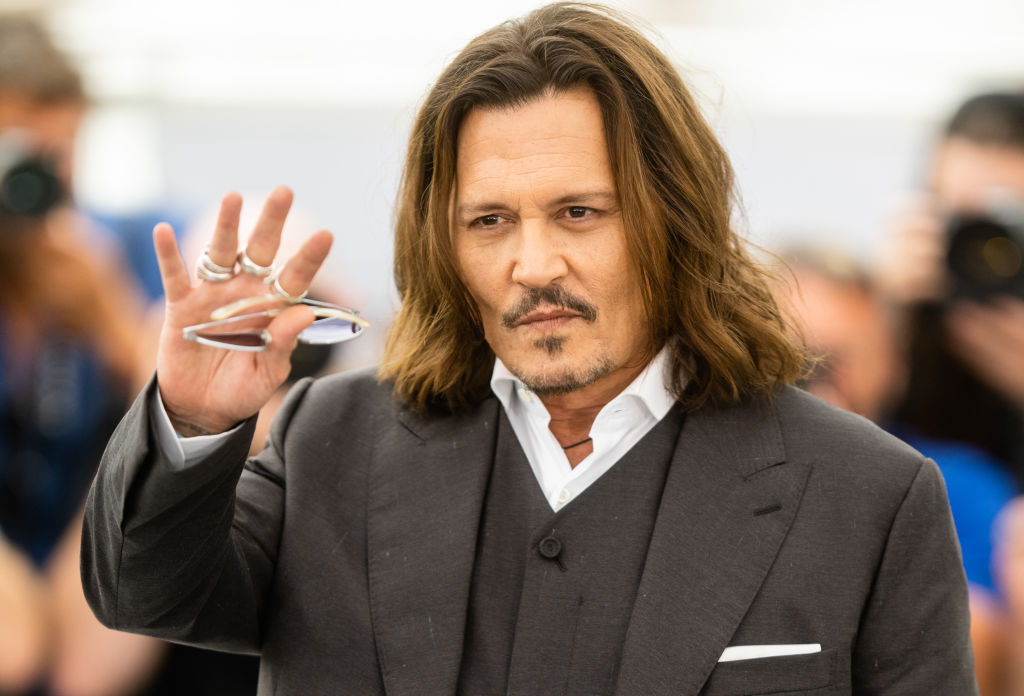 Johnny Depp roasts Hollywood, gets 7-minute ovation at Cannes.
