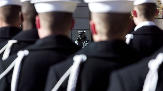 WASHINGTON - DECEMBER 7: U.S. Navy sailors form a ceremonial guard at a wreath-laying ceremony to memorialize the victims of the attack on Pearl Harbor and pay tribute to the veterans of World War II in front of the Lone Sailor statue at the Naval Memorial December 7, 2003 in Washington, DC. Ceremonies are planned across the country to honor the 62nd anniversary of the attack by Japanese forces on the U.S. Naval base at Pearl Harbor on December 7, 1941. (Photo by Brendan Smialowski/Getty Images)