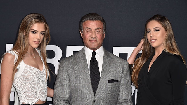 LOS ANGELES, CA - FEBRUARY 10: Actor Sylvester Stallone (C) and daughters Sistene Stallone (L) and Sophia Stallone (R) attend Saint Laurent at Hollywood Palladium on February 10, 2016 in Los Angeles, California. (Photo by C Flanigan/WireImage)