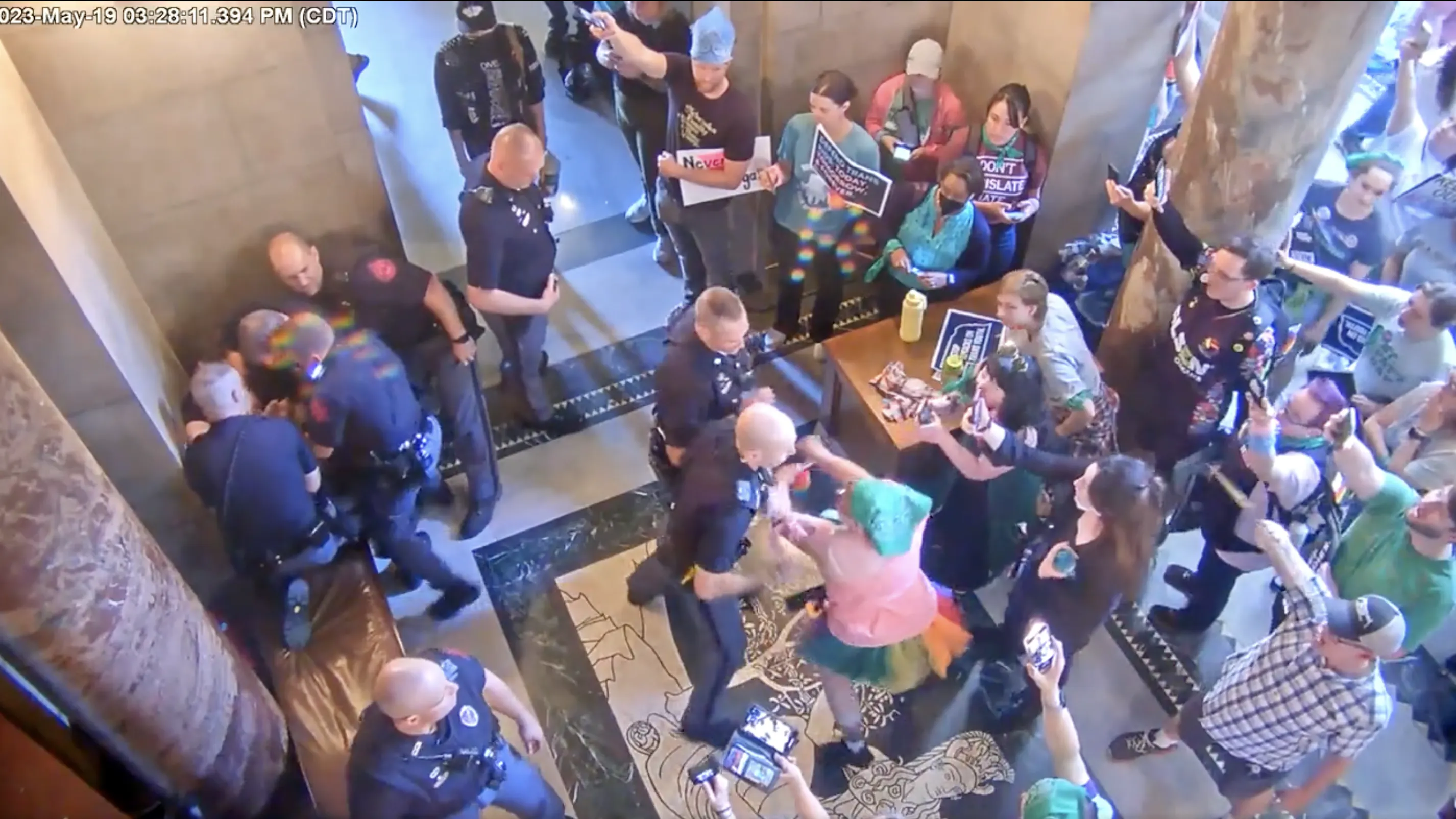 WATCH: Protester Takes Swing At Police Officer As Republicans Vote To Ban Trans Procedures On Minors, Police Say