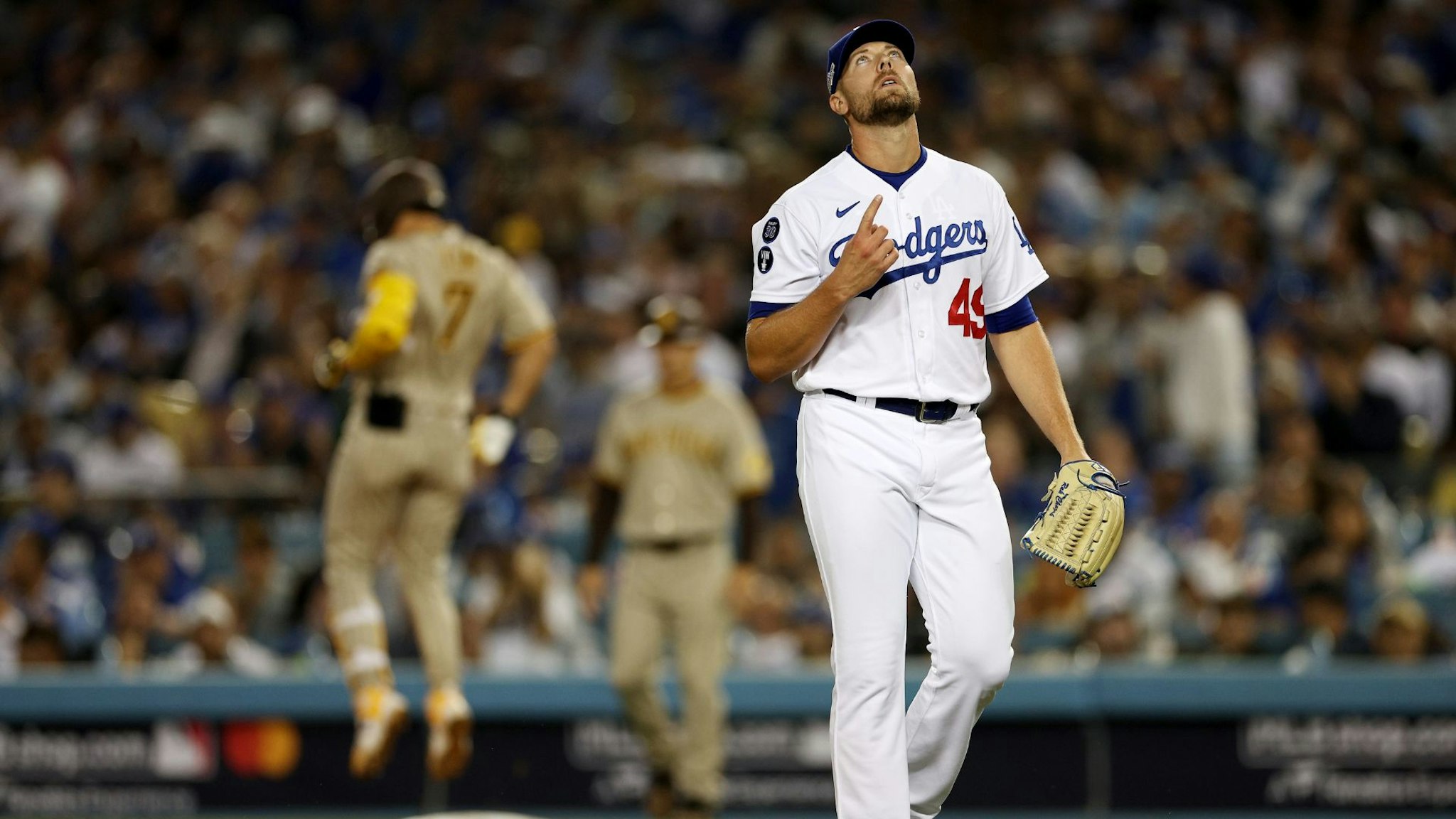 LOS ANGELES, CALIFORNIA - OCTOBER 12: Blake Treinen #49 of the Los Angeles Dodgers reacts after the third out in the eighth inning in game two of the National League Division Series against the San Diego Padres at Dodger Stadium on October 12, 2022 in Los Angeles, California.
