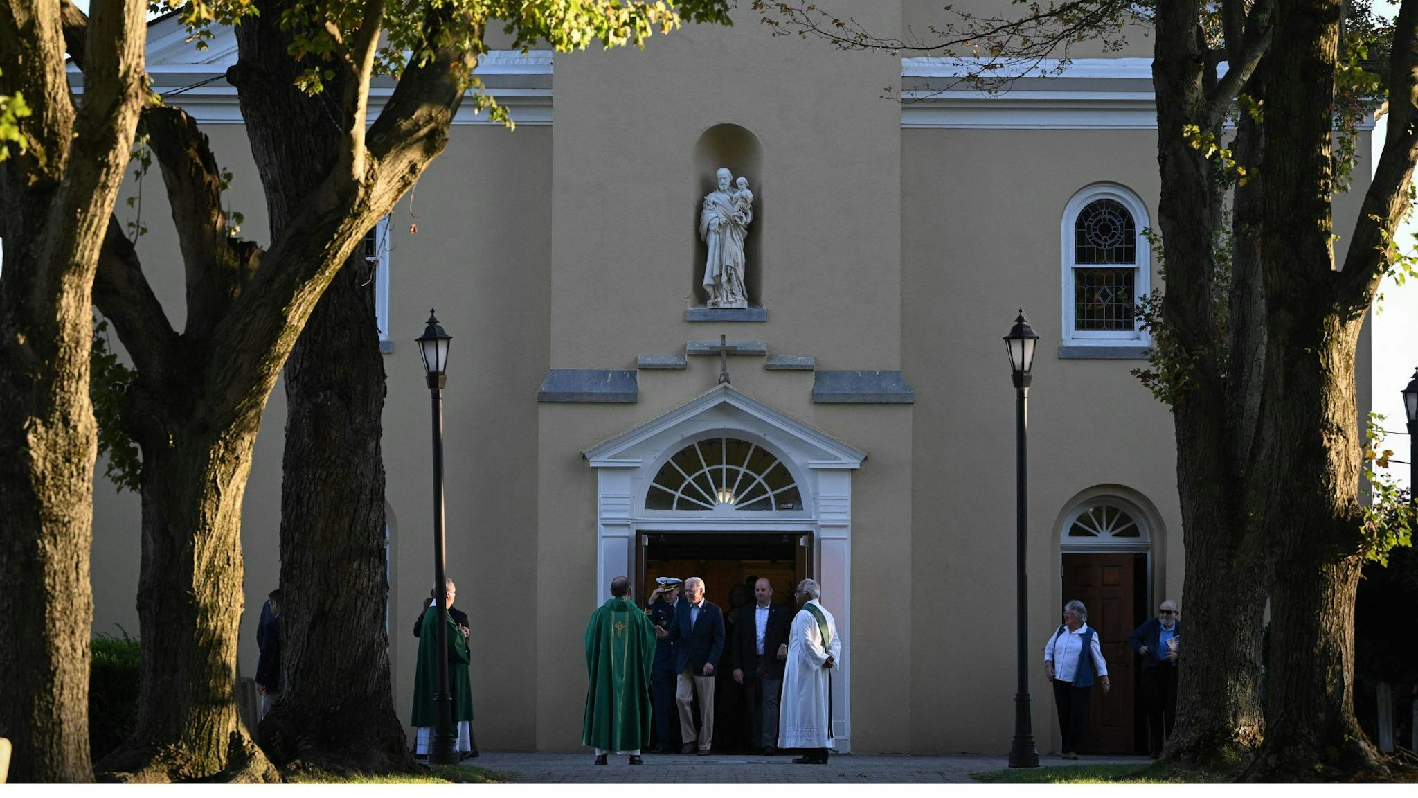 US President Joe Biden (C) steps out of Saint Joseph on the Brandywine Roman Catholic Church after attending mass in Wilmington, Delaware on October 8, 2022.