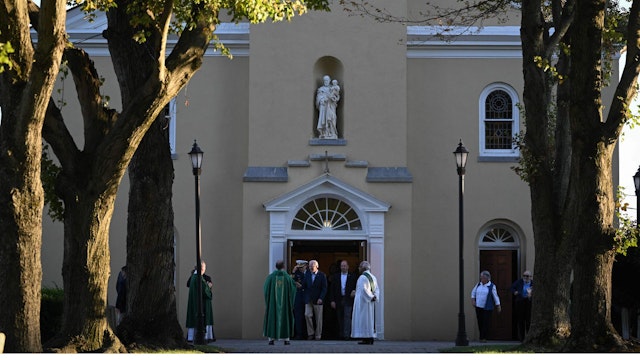 US President Joe Biden (C) steps out of Saint Joseph on the Brandywine Roman Catholic Church after attending mass in Wilmington, Delaware on October 8, 2022.