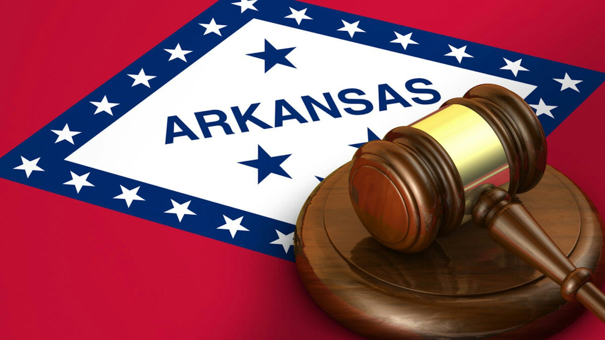 Arkansas US state law, code, legal system and justice concept with a 3d render of a gavel on the Arkansan flag on background.
