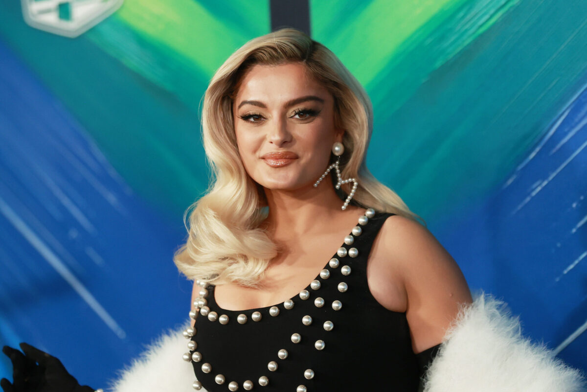 Bebe Rexha hurriedly leaves stage after being struck by cell phone.