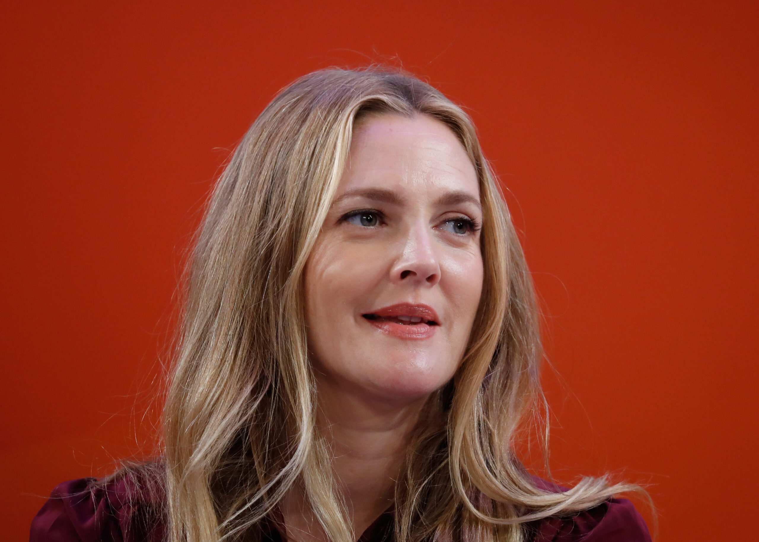 Drew Barrymore criticizes tabloids for saying she wants her mom to die.