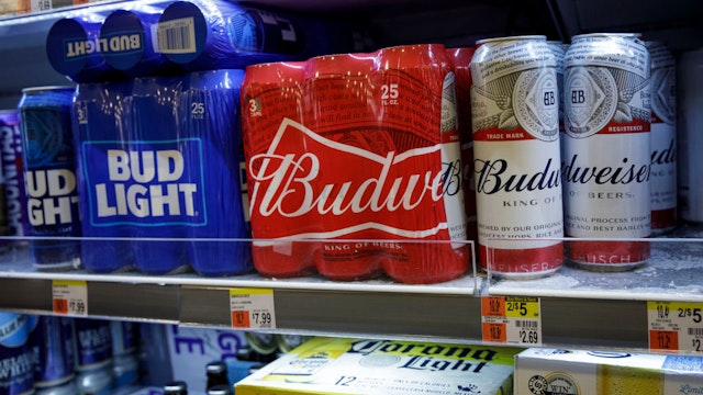 NEW YORK, NY - JULY 26: Cans of Budweiser and Bud Light sit on a shelf for sale at a convenience store, July 26, 2018 in New York City. Anheuser-Busch InBev, the brewer behind Budweiser and Bud Light, said on Thursday that U.S. revenues fell 3.1% in the second quarter. American consumers continue to shift away from domestic lagers and toward crafts beers and wine and spirits.
