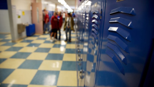 blue school hallway lockers and checkered tile in high school students in the background (down-sampled to increase sharpness)