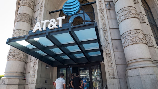 Shoppers wait to enter an AT&amp;T Inc. store in San Francisco, California, U.S., on Tuesday, July 21, 2020. AT&amp;T is expected to release earnings figures on July 23. Photographer: David Paul Morris/Bloomberg via Getty Images