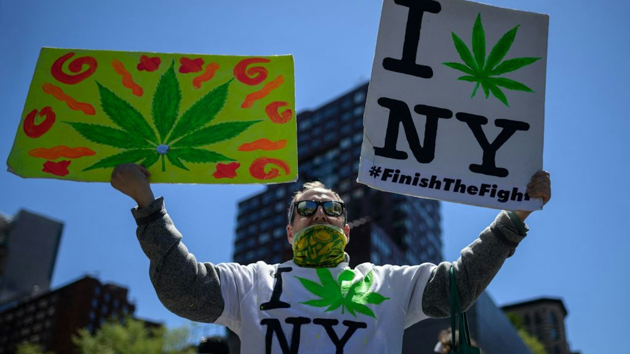 Demonstrators march in the annual NYC Cannabis Parade &amp; Rally in support of the legalization of marijuana for recreational and medical use, on May 1, 2021 in New York City. - New York Governor Andrew Cuomo signed legislation legalizing recreational marijuana on March 31, 2021, with a large chunk of tax revenues from sales set to go to minority communities. (Photo by Angela Weiss / AFP) (Photo by ANGELA WEISS/AFP via Getty Images)