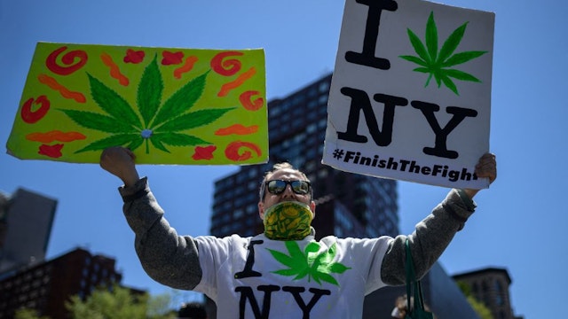 Demonstrators march in the annual NYC Cannabis Parade &amp; Rally in support of the legalization of marijuana for recreational and medical use, on May 1, 2021 in New York City. - New York Governor Andrew Cuomo signed legislation legalizing recreational marijuana on March 31, 2021, with a large chunk of tax revenues from sales set to go to minority communities. (Photo by Angela Weiss / AFP) (Photo by ANGELA WEISS/AFP via Getty Images)