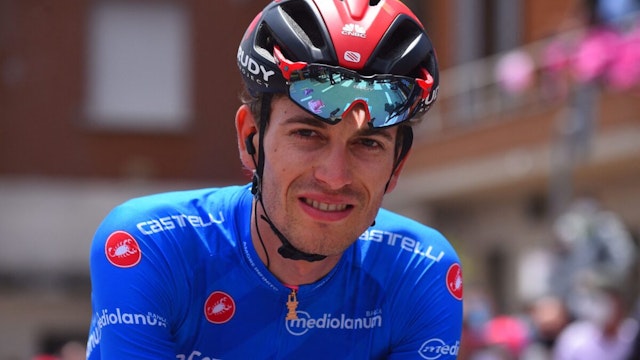 Team Bahrain rider Switzerland's Gino Mader wearing the best climber's blue jersey, poses prior to the start of the seventh stage of the Giro d'Italia 2021 cycling race, 181 km between Notaresco and Termoli on May 14, 2021.