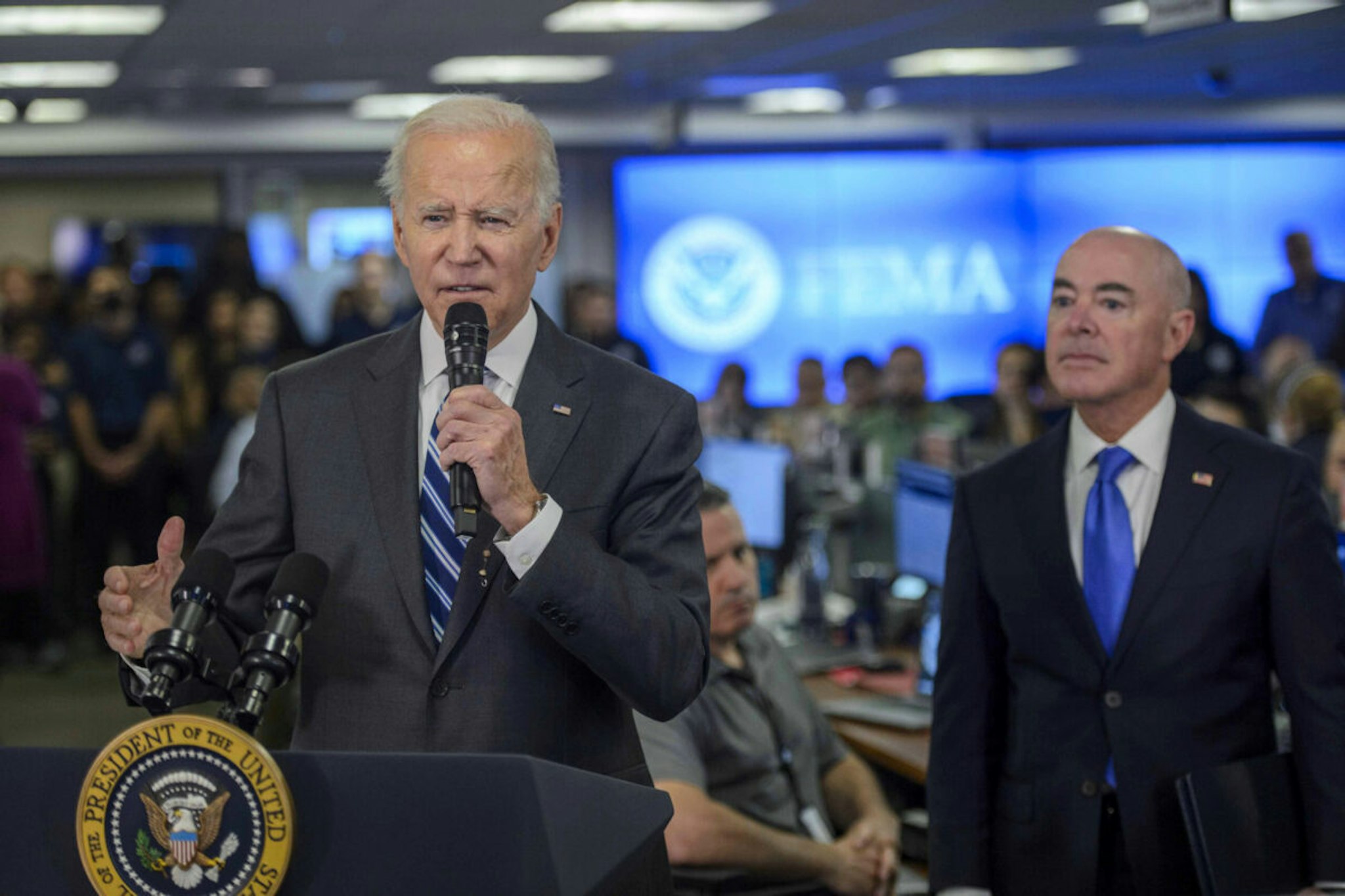 US President Joe Biden speaks beside Alejandro Mayorkas, secretary of the US Department of Homeland Security (DHS), at the Federal Emergency Management Agency (FEMA) headquarters in Washington, DC, US, on Thursday, Sept. 29, 2022. Biden and his administration began today to contend with Hurricane Ian, a storm poised to rank among the nation's costliest natural disasters after devastating southwest Florida.