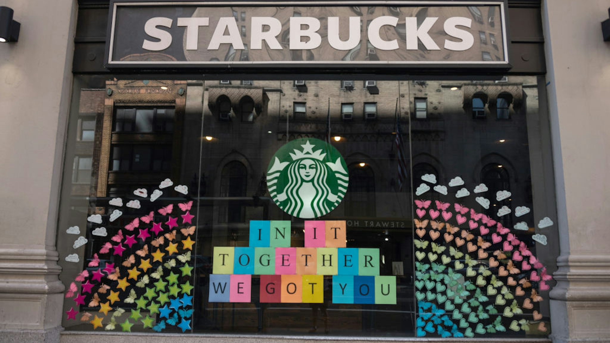 NEW YORK, NEW YORK - JUNE 21: The view of a Starbucks coffee shop displaying pride colors on June 21, 2020 in New York City. Due to the ongoing Coronavirus pandemic, this year's pride march had to be canceled over health concerns. The annual event, which sees millions of attendees, marks it's 50th anniversary since the first march following the Stonewall Inn riots. (Photo by Alexi Rosenfeld/Getty Images)