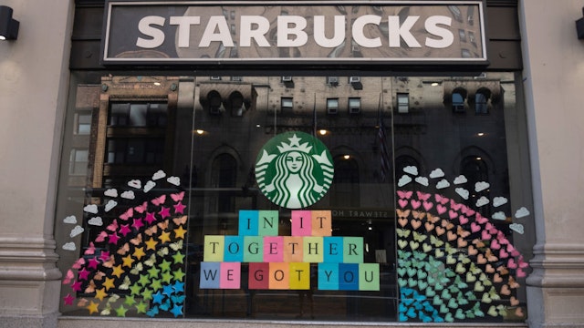 NEW YORK, NEW YORK - JUNE 21: The view of a Starbucks coffee shop displaying pride colors on June 21, 2020 in New York City. Due to the ongoing Coronavirus pandemic, this year's pride march had to be canceled over health concerns. The annual event, which sees millions of attendees, marks it's 50th anniversary since the first march following the Stonewall Inn riots. (Photo by Alexi Rosenfeld/Getty Images)