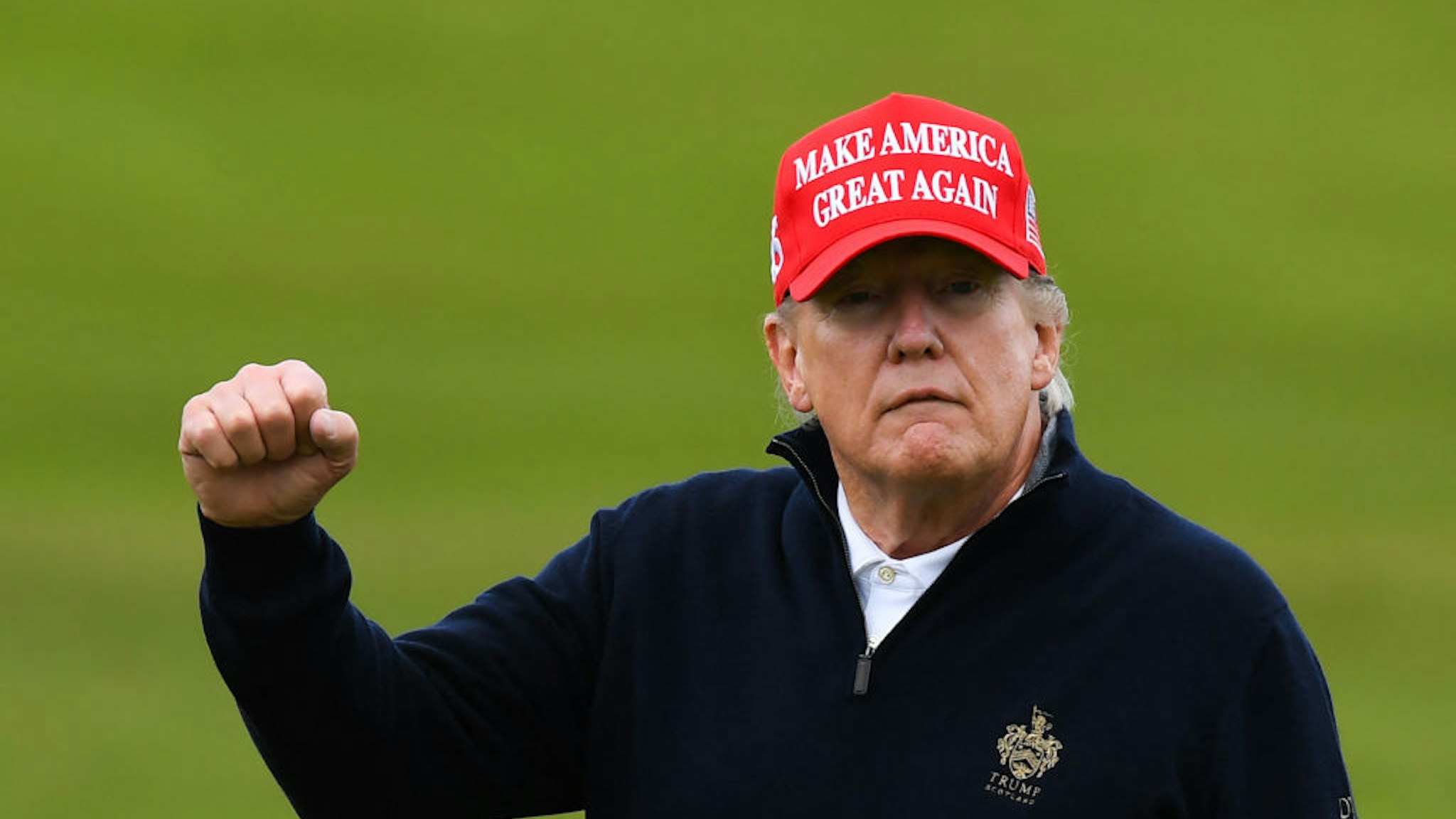 Former US President Donald Trump reacts as he plays golf at the Trump Turnberry Golf Courses, in Turnberry on the west coast of Scotland on May 2, 2023, during the second day of his first visit to the country since losing the Presidency. (Photo by ANDY BUCHANAN / AFP)
