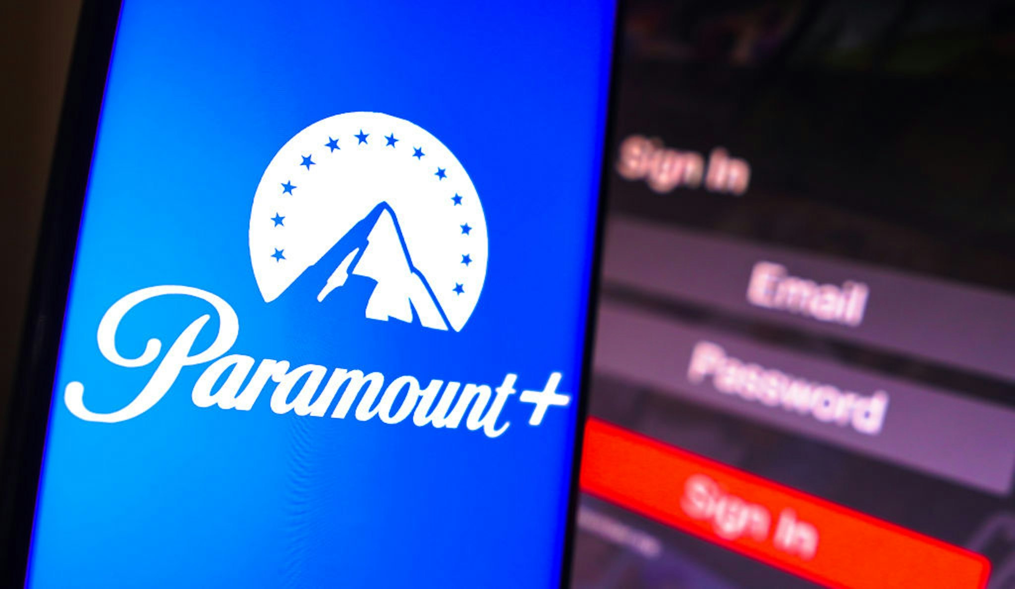 BRAZIL - 2023/05/02: In this photo illustration, the Paramount Plus logo is displayed on a smartphone screen, next to a login screen, with email, password and sign in. (Photo Illustration by Rafael Henrique/SOPA Images/LightRocket via Getty Images)