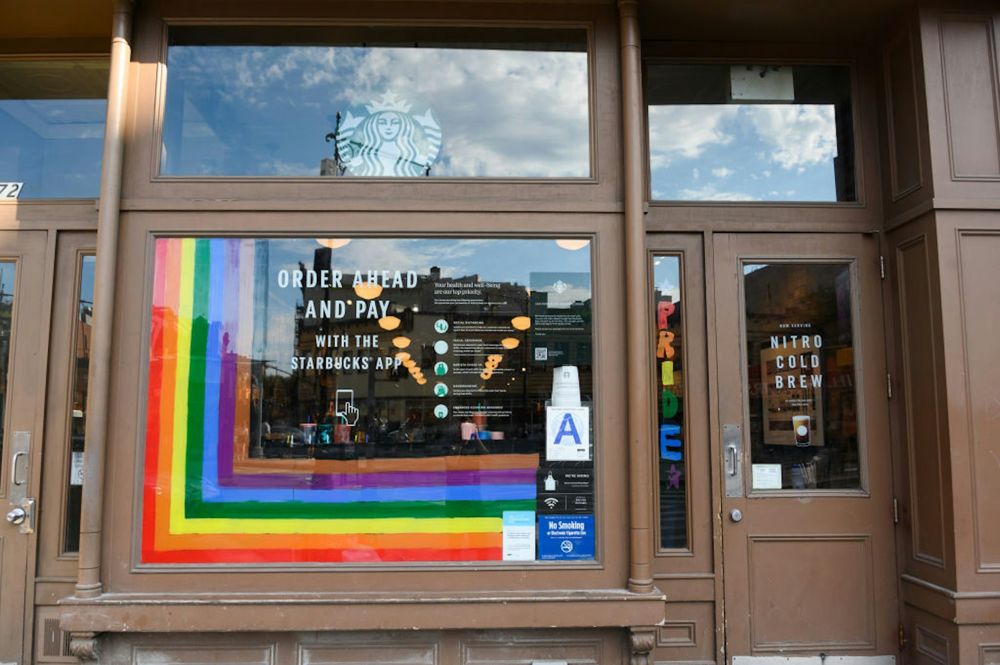 NEW YORK, NEW YORK - JUNE 26: Rainbow art is seen outside Starbucks in the West Village on June 26, 2020 in New York City. Due to the ongoing Coronavirus pandemic, this year's pride march had to be canceled over health concerns. The annual event, which sees millions of attendees, marks its 50th anniversary since the first march following the Stonewall Inn riots. (Photo by Noam Galai/Getty Images)
