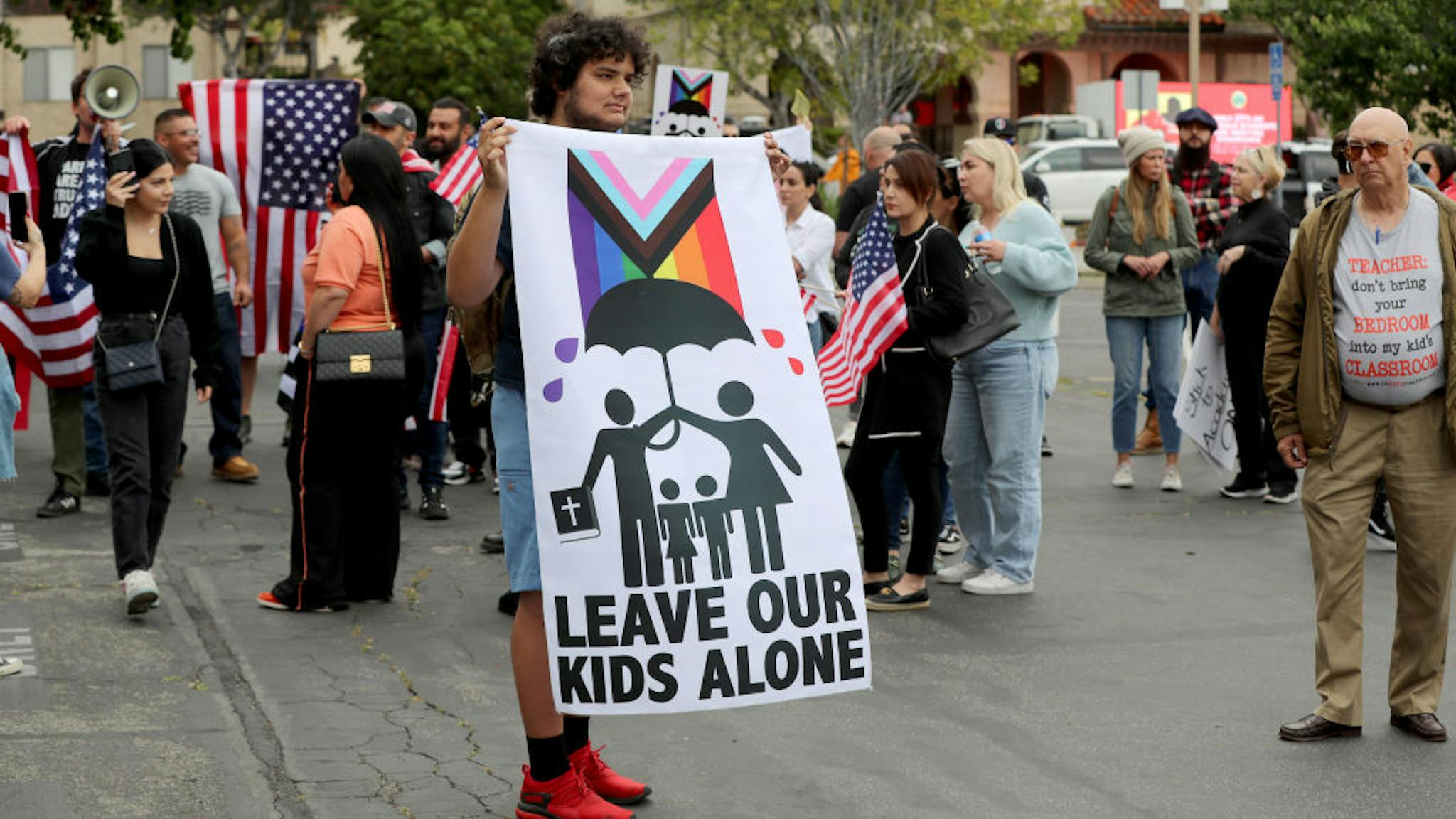 Protestors face off with their opposing opinions as they join crowds gathering outside a Glendale Unified School District meeting where parents and activists differ over teaching sexual identity to kids at Glendale Unified School District in Burbank