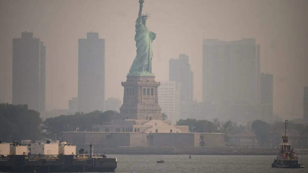 Statue Of Liberty, NYC Engulfed In Smoke As Canadian Fires Threaten Northeast U.S.