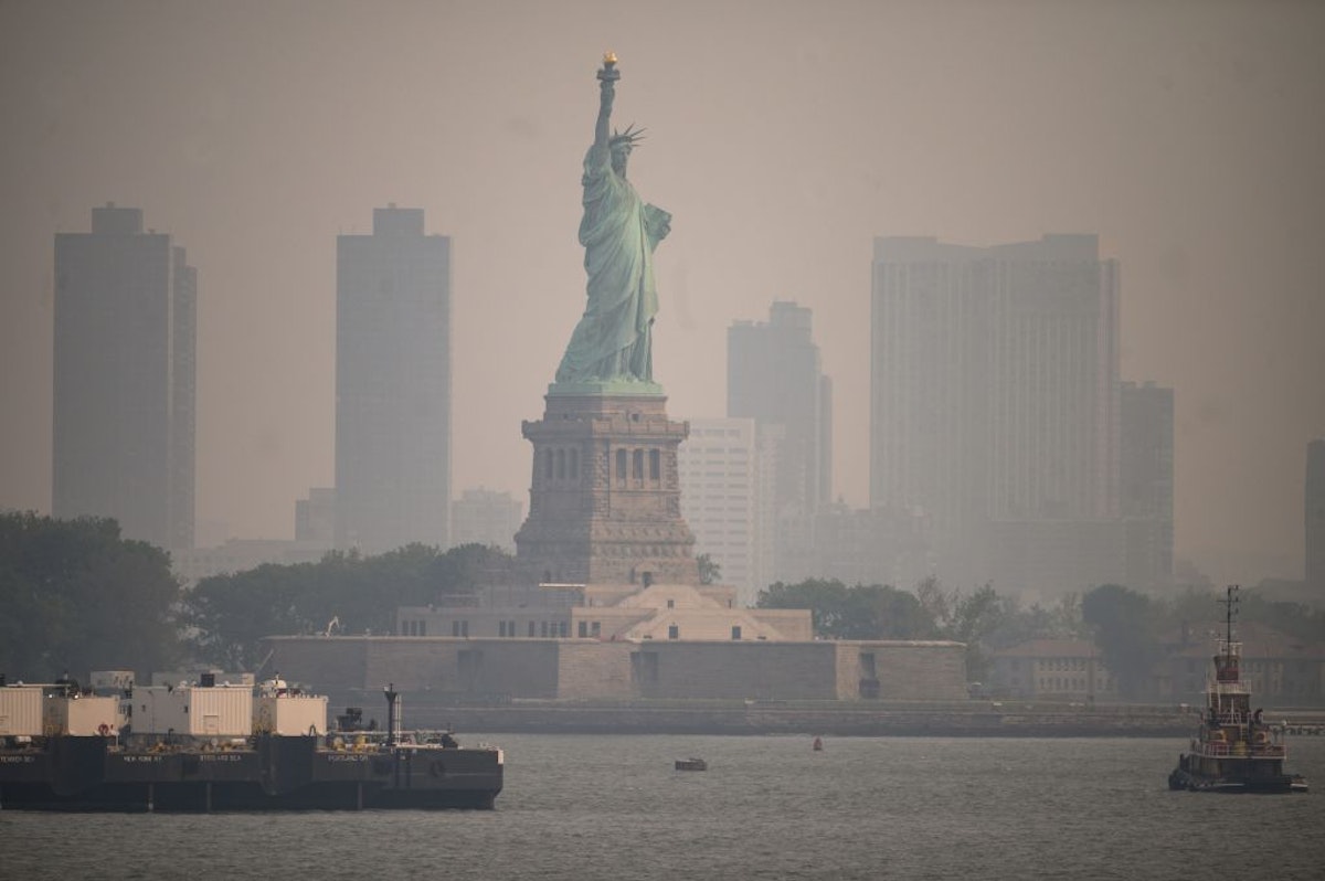 Statue Of Liberty, NYC Engulfed In Smoke As Canadian Fires Threaten Northeast U.S.