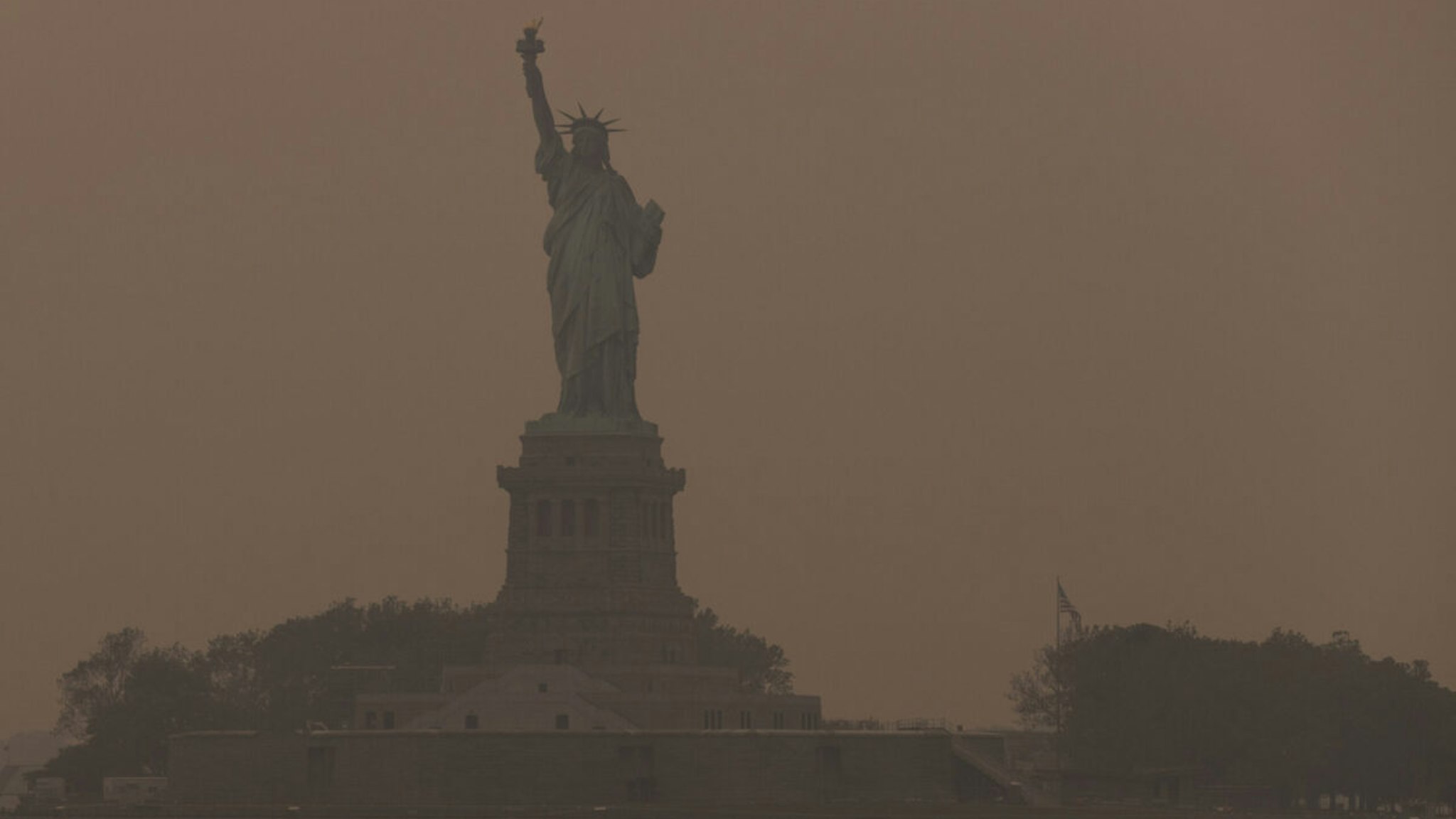 The Statue of Liberty shrouded in smoke from Canada wildfires in New York, US, on Wednesday, June 7, 2023.