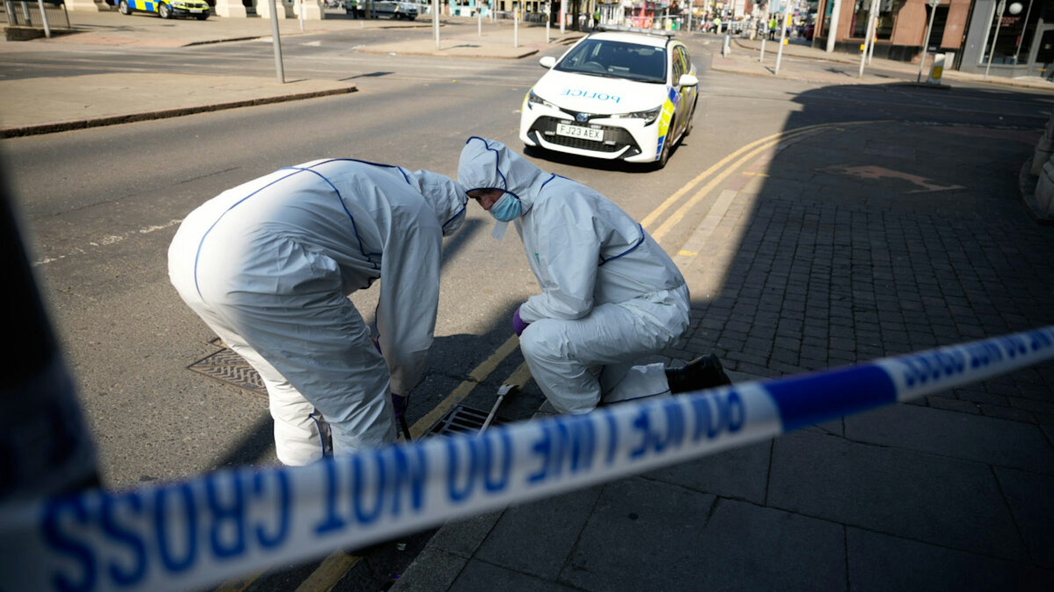 NOTTINGHAM, ENGLAND - JUNE 13: Forensic police search an area in the city centre after several people were attacked earlier today on June 13, 2023 in Nottingham, England. Nottinghamshire police said a man had been arrested on suspicion of murder after three people were found dead earlier today in areas of Nottingham City Centre.