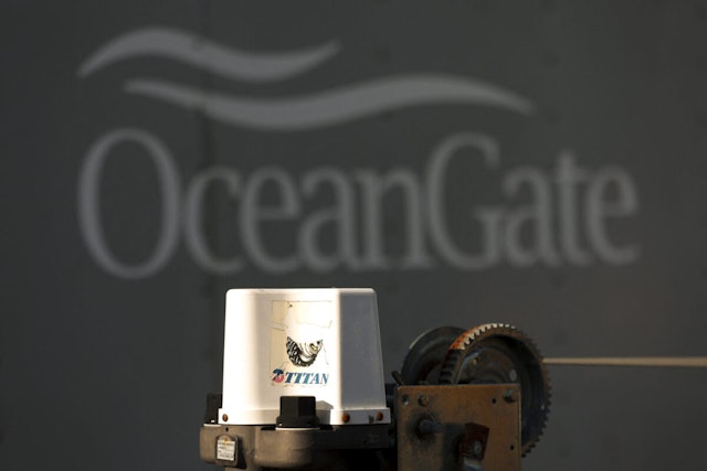 A decal on a piece of equipment which reads "Titan" is pictured near a trailer with the OceanGate logo at OceanGate Expedition's headqurters in the Port of Everett Boat Yard in Everett, Washington, on June 22, 2023. All five people aboard a submersible missing near the wreck of the Titanic died -- likely in an instant -- after their vessel suffered what the US Coast Guard said June 22, 2023 was a "catastrophic implosion" in the ocean depths.