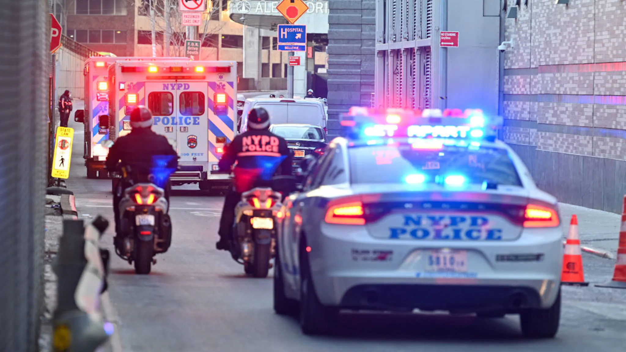 Second NYPD Officer Dies After Ambush In Harlem Building NEW YORK, NEW YORK - JANUARY 25: NYPD transfer the body of Officer Wilbert Mora in an Ambulance from NYU Langone Hospital on January 25, 2022 in the Harlem neighborhood of New York City. Officer Wilbert Mora was critically injured after responding to a domestic violence call on Friday January 21st, while his partner, twenty-two-year-old Officer Jason Rivera was shot and killed. (Photo by Alexi J. Rosenfeld/Getty Images)