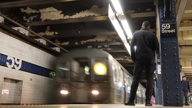 A man waits to board a subway train at the Columbus Circle - 59th Street station on March 27, 2023, in New York City.
