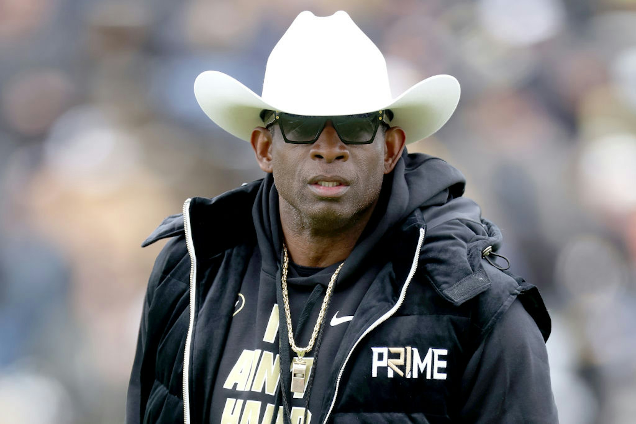BOULDER, COLORADO - APRIL 22: Head coach Deion Sanders of the Colorado Buffaloes watches as his team warms up prior to their spring game at Folsom Field on April 22, 2023 in Boulder, Colorado.
