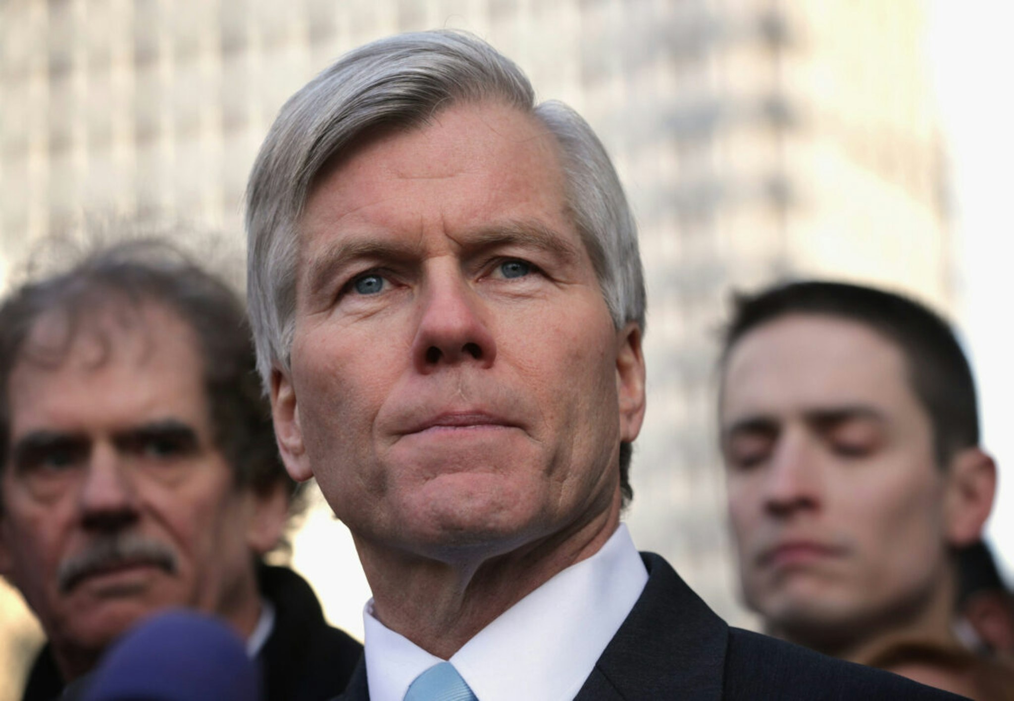 Former Virginia Governor Robert McDonnell (C) pauses as he speaks to members of the media outside U.S. District Court for the Eastern District of Virginia after his sentencing was announced by a federal judge January 6, 2015, in Richmond, Virginia. McDonnell was sentenced 24 months in prison for 11 counts of corruption charges.