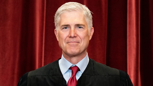 WASHINGTON, DC - APRIL 23: Associate Justice Neil Gorsuch stands during a group photo of the Justices at the Supreme Court in Washington, DC on April 23, 2021.