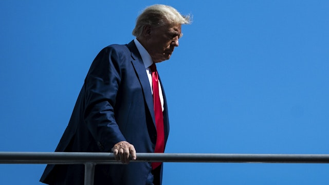 Miami, FL - June 13 : Former President Donald Trump boards his airplane, known as "Trump Force One," to fly back to NJ minutes after pleading not guilty to federal charges, on Tuesday, June 13, 2023, in Miami, FL.
