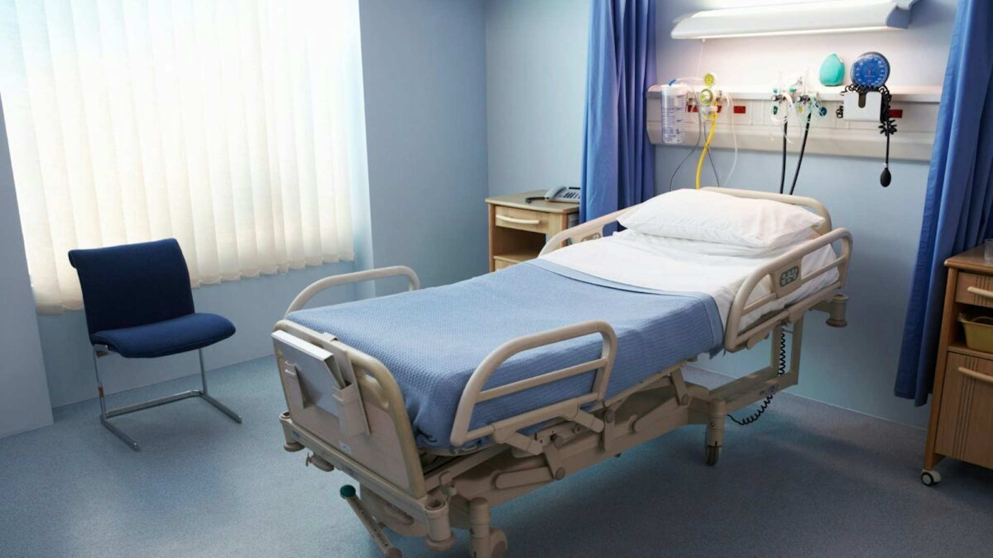 Empty Hospital Bed in a Ward - stock photo