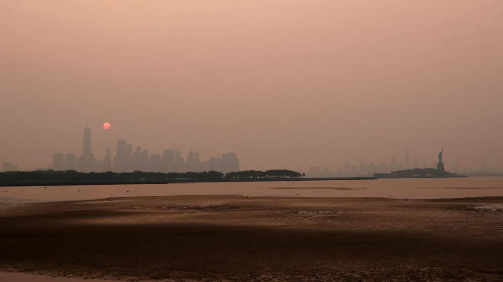 SEE IT: Canadian Wildfire Smoke Shrouds New York City, Much Of The Northeast In Eerie Orange-Yellow Haze
