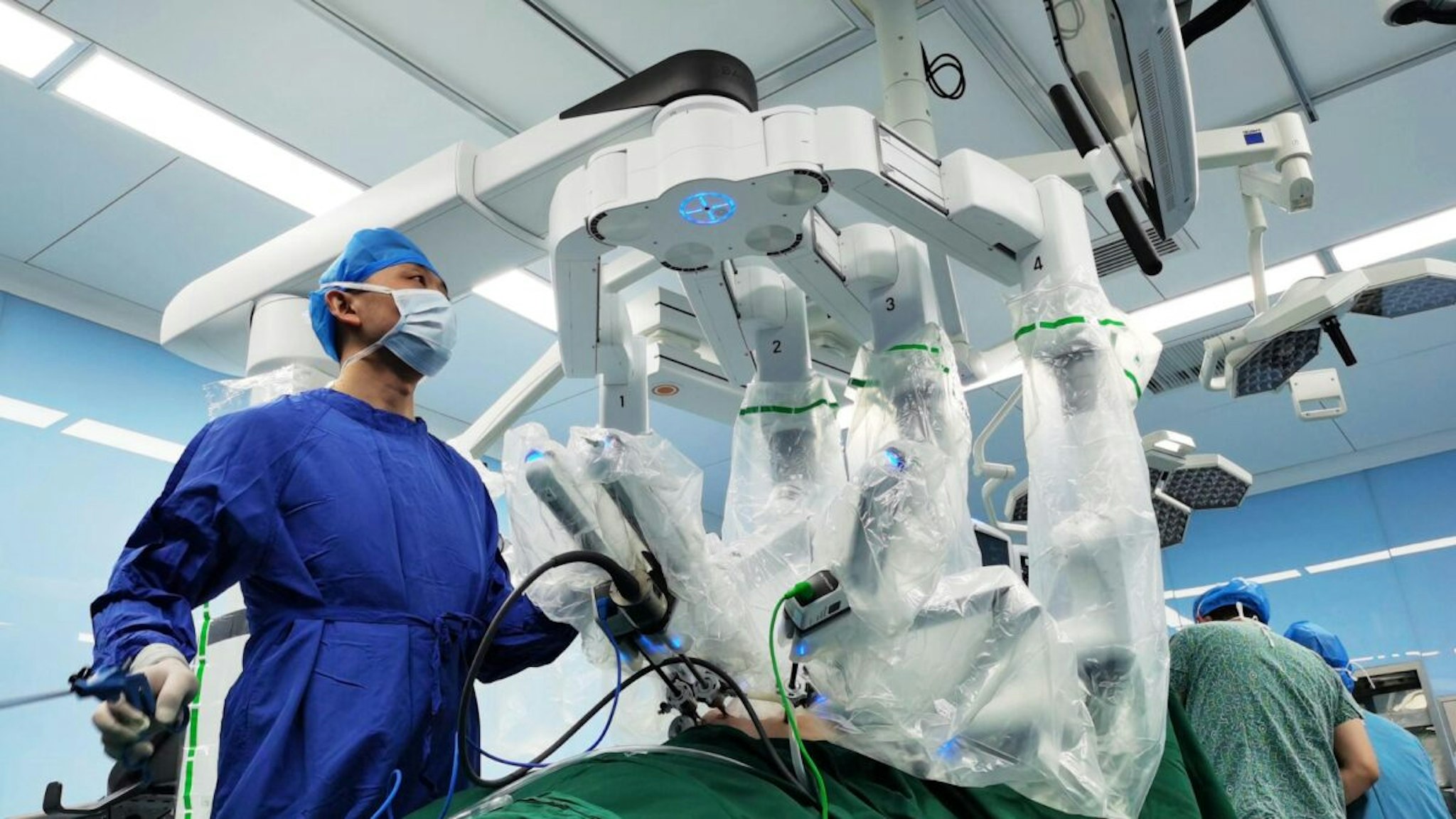 Surgeons operate a da Vinci Surgical robot during a surgical operation at Qinghai Provincial People's Hospital on June 11, 2020 in Xining, Qinghai Province of China.