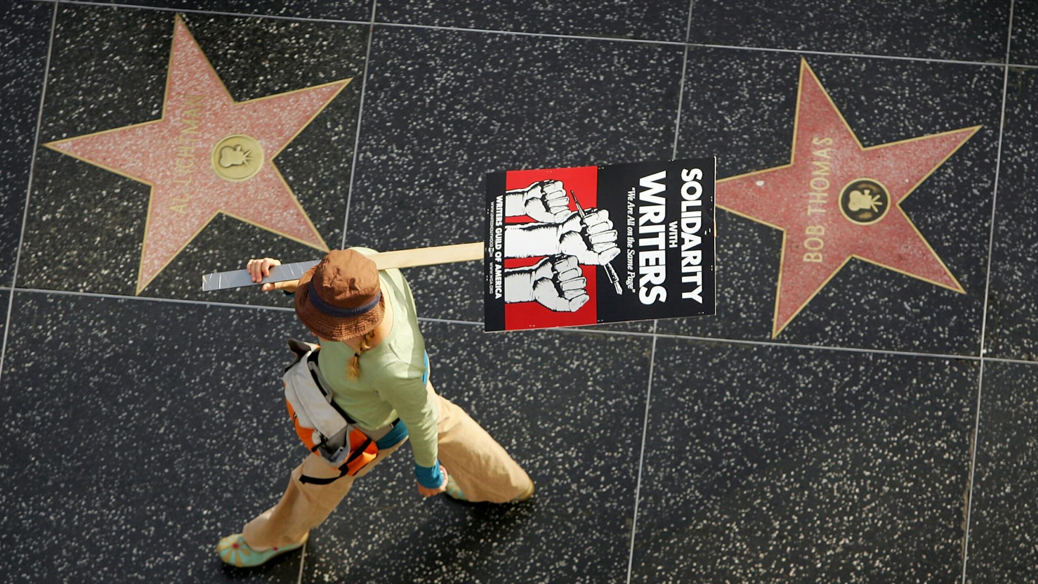 Strike Members of various unions including the Teamsters, Service Employees International Union (SEIU), and California Nurses Association, march in solidarity with striking Hollywood writers on Hollywood Boulevard and the Hollywood Walk of Fame as the labor dispute between the Writers Guild of America (WGA) and producers continues on November 20, 2007 in the Hollywood section of Los Angeles, California.