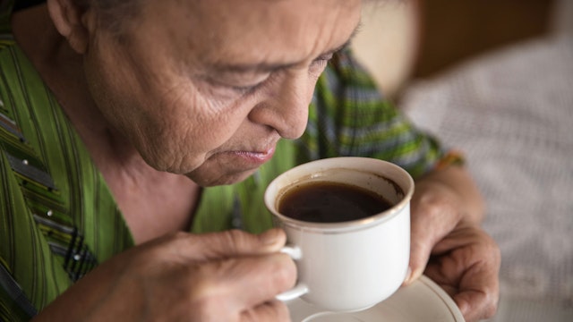 Senior woman having a cup of coffee at home