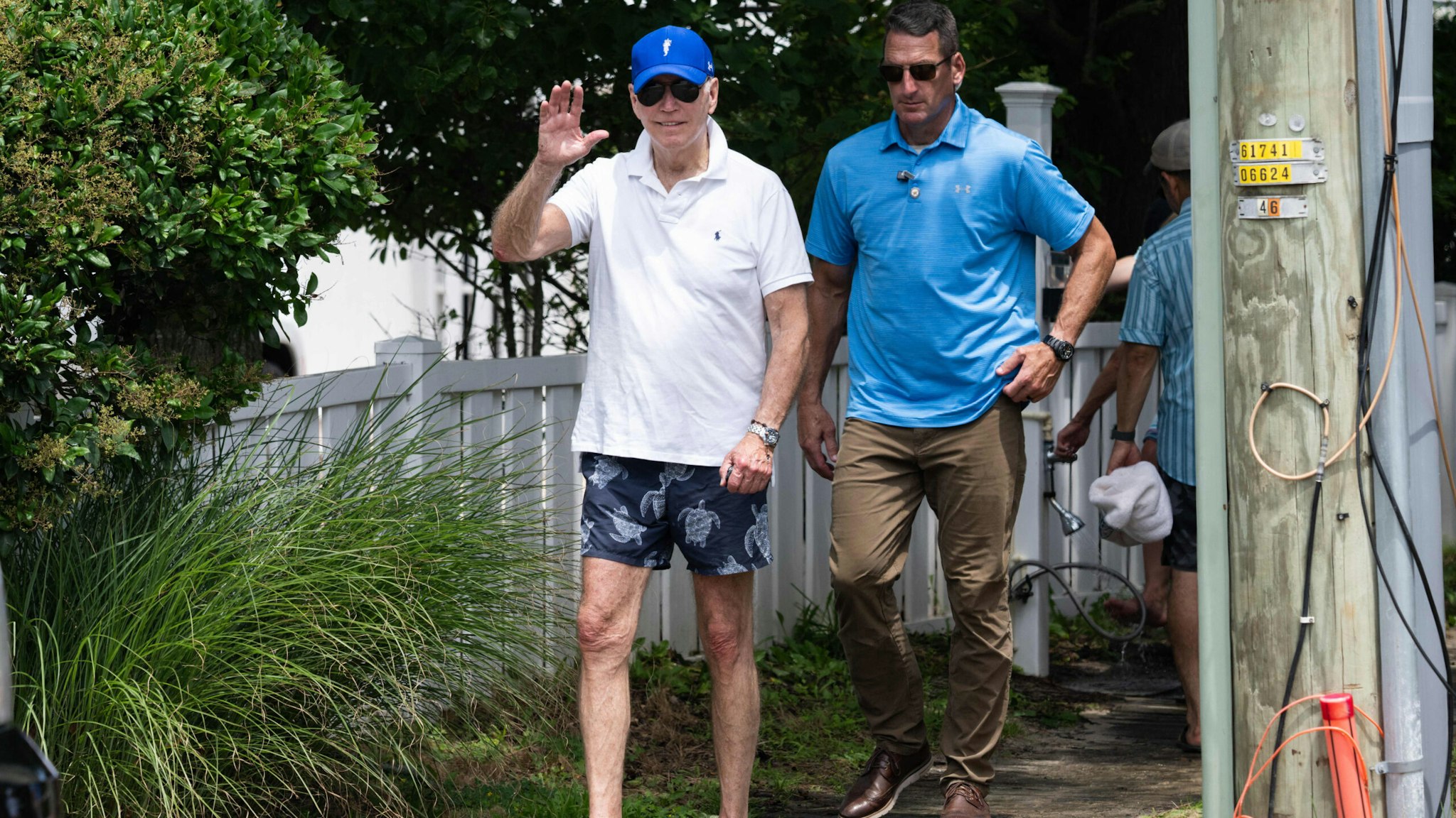 US President Joe Biden leaves the beach near his home in Rehoboth Beach, Delaware, July 8, 2023, as he spends the weekend at his vacation home.