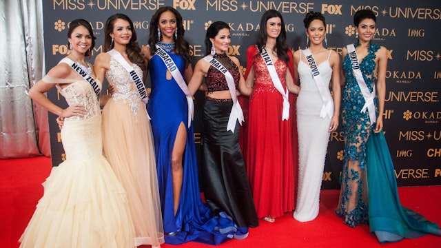 Candidates from New Zealand, Hungary, Curacao, Malta, Italy, Kosovo, and Mexico pose for pictures at the SMX in Pasay City. Miss Universe candidates walked the red carpet at the SMX in Pasay City a day before the coronation.