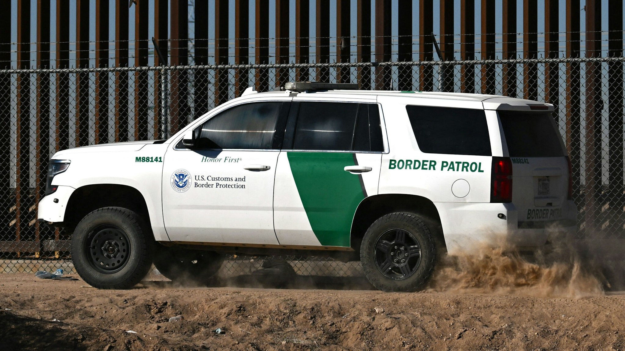 A US Customs and Border Protection Border Patrol vehicle is driven along the US-Mexico border wall in El Paso, Texas on May 10, 2023. The US on May 11, 2023, will officially end its 40-month Covid-19 emergency, also discarding the Title 42 law, a tool that has been used to prevent millions of migrants from entering the country.