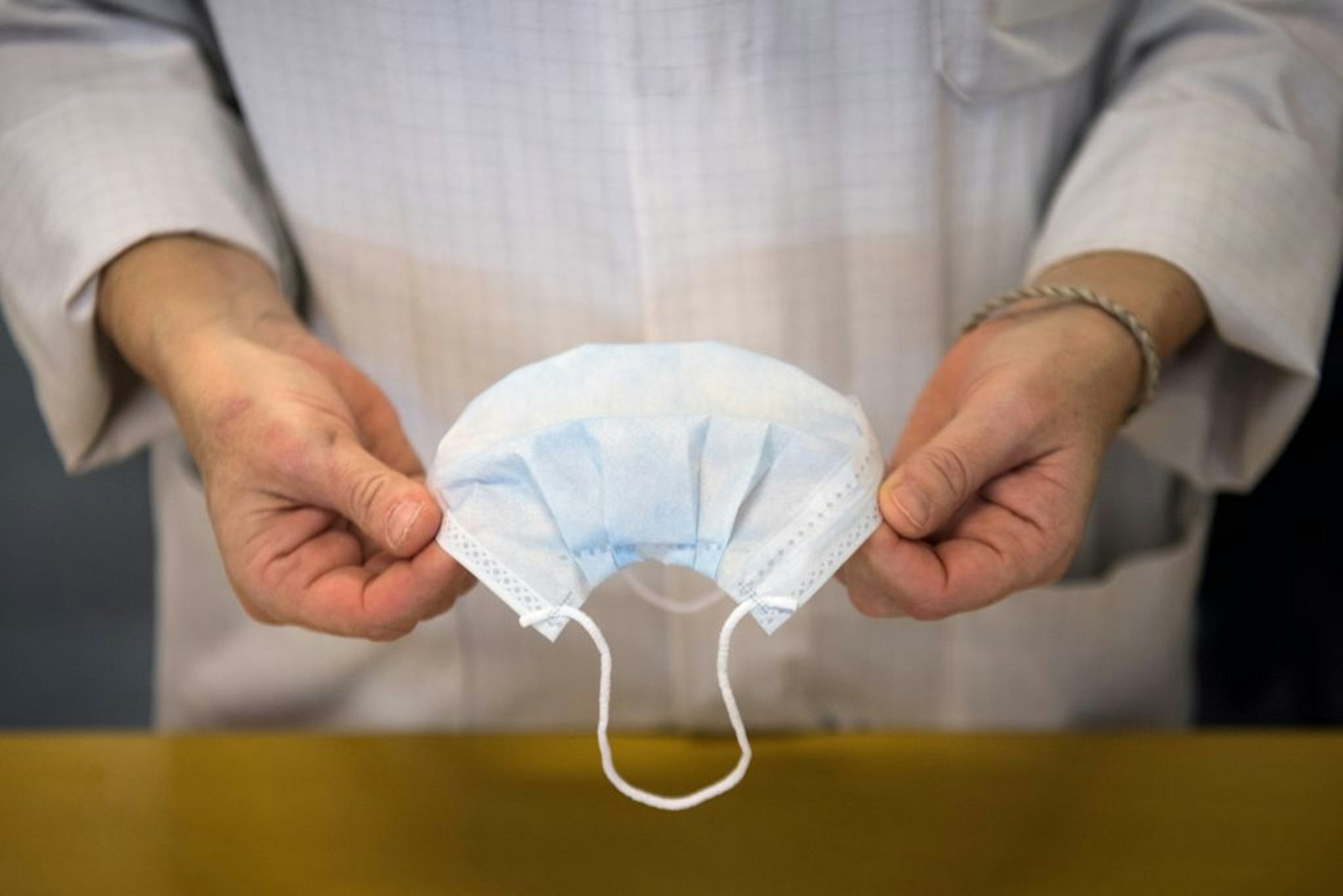 TOPSHOT - An employee controls health protection masks in a production chain of the Kolmi-Hopen company's factory, on February 1, 2020 in Saint-Barthelemy-d'Anjou, western France. - The company indicated receiving hundreds of millions of orders for health protection masks due to cases of coronavirus that emerged in a market in the central Chinese city of Wuhan. The coronavirus outbreak has so far killed more than 250 people and infected thousands in mainland China and beyond and has forced governments around the world to take drastic measures. (Photo by Loic VENANCE / AFP) (Photo by LOIC VENANCE/AFP via Getty Images)