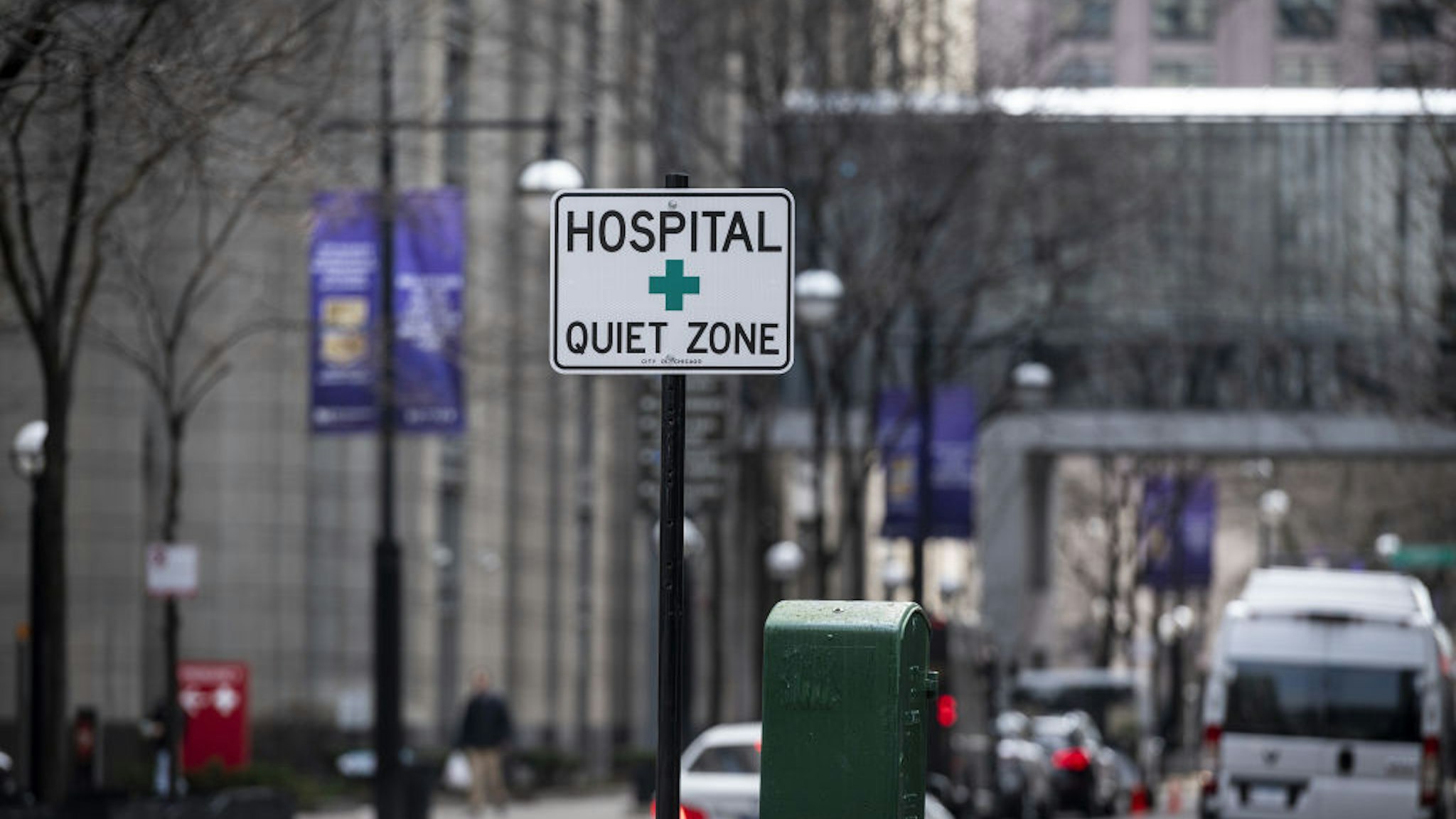 A sign reading "Hospital Quiet Zone" stands outside Northwestern Memorial Hospital in Chicago, Illinois, U.S., on Friday, April 3, 2020. The world's workers are reeling from the initial shock of the coronavirus recession, with job losses and welfare claims around the globe already running into the millions this week.