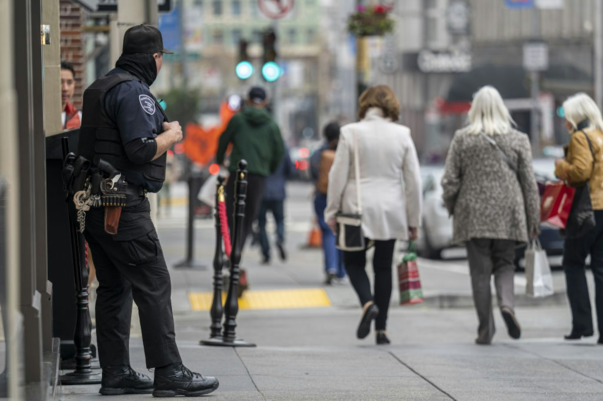 A security guard outside of a store in San Francisco, California, U.S., on Monday, Dec. 6, 2021. California Governor Gavin Newsom said that "the level of organized retail theft we are seeing is simply unacceptable" as he boosted police presence in major retail sites. Photographer: David Paul Morris/Bloomberg via Getty Images