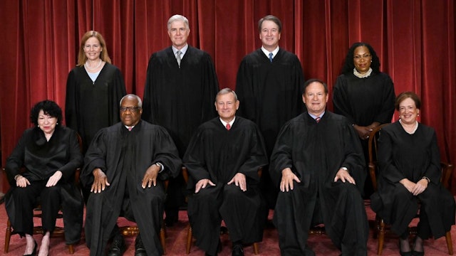 Justices of the US Supreme Court pose for their official photo at the Supreme Court in Washington, DC on October 7, 2022. - (Seated from left) Associate Justice Sonia Sotomayor, Associate Justice Clarence Thomas, Chief Justice John Roberts, Associate Justice Samuel Alito and Associate Justice Elena Kagan, (Standing behind from left) Associate Justice Amy Coney Barrett, Associate Justice Neil Gorsuch, Associate Justice Brett Kavanaugh and Associate Justice Ketanji Brown Jackson. (Photo by OLIVIER DOULIERY / AFP) (Photo by OLIVIER DOULIERY/AFP via Getty Images)